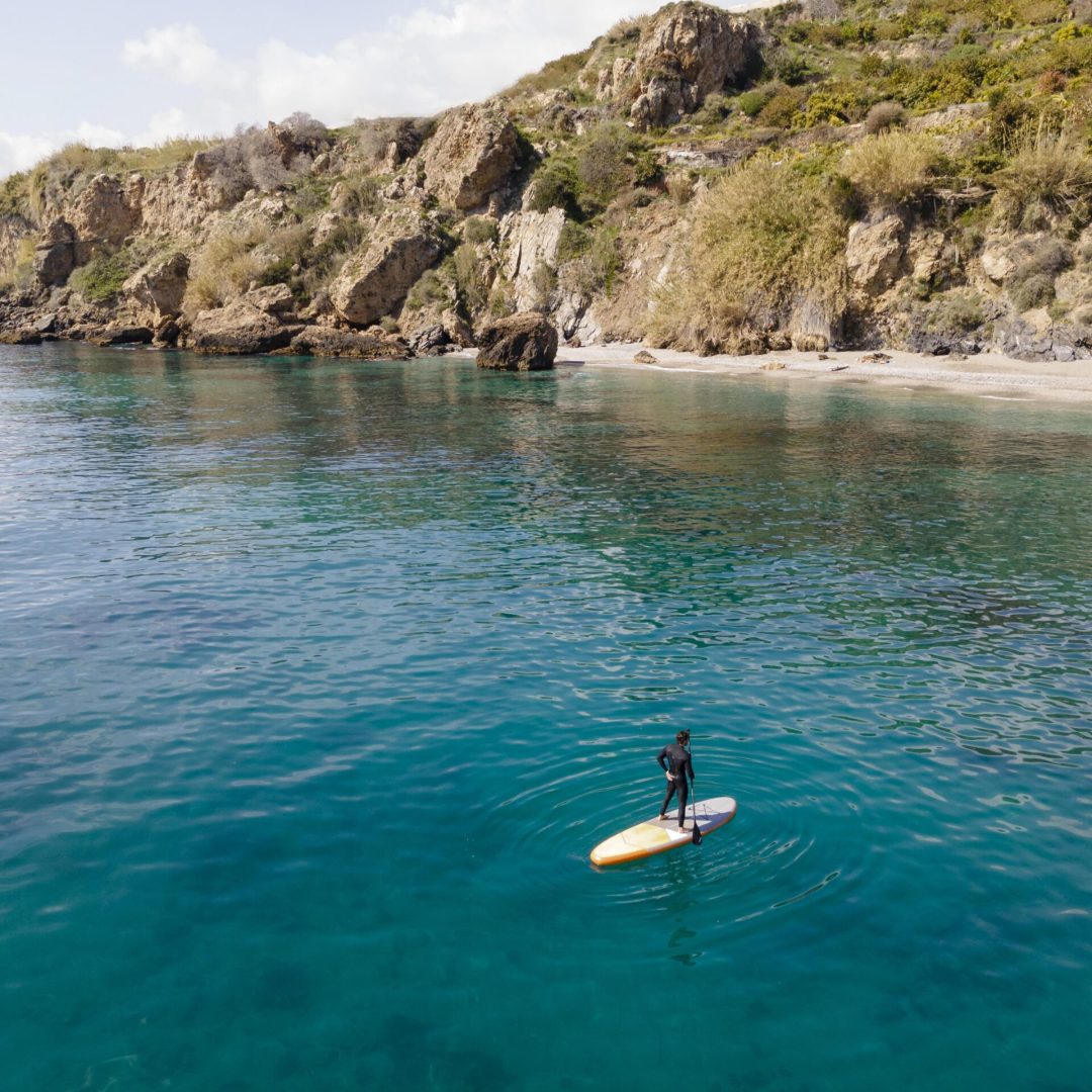 man surfing with beautiful view long shot